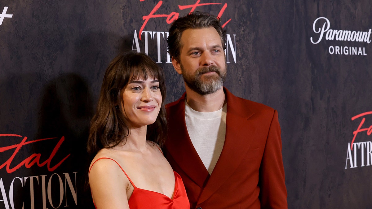 Joshua Jackson posing with Lizzy Kaplan