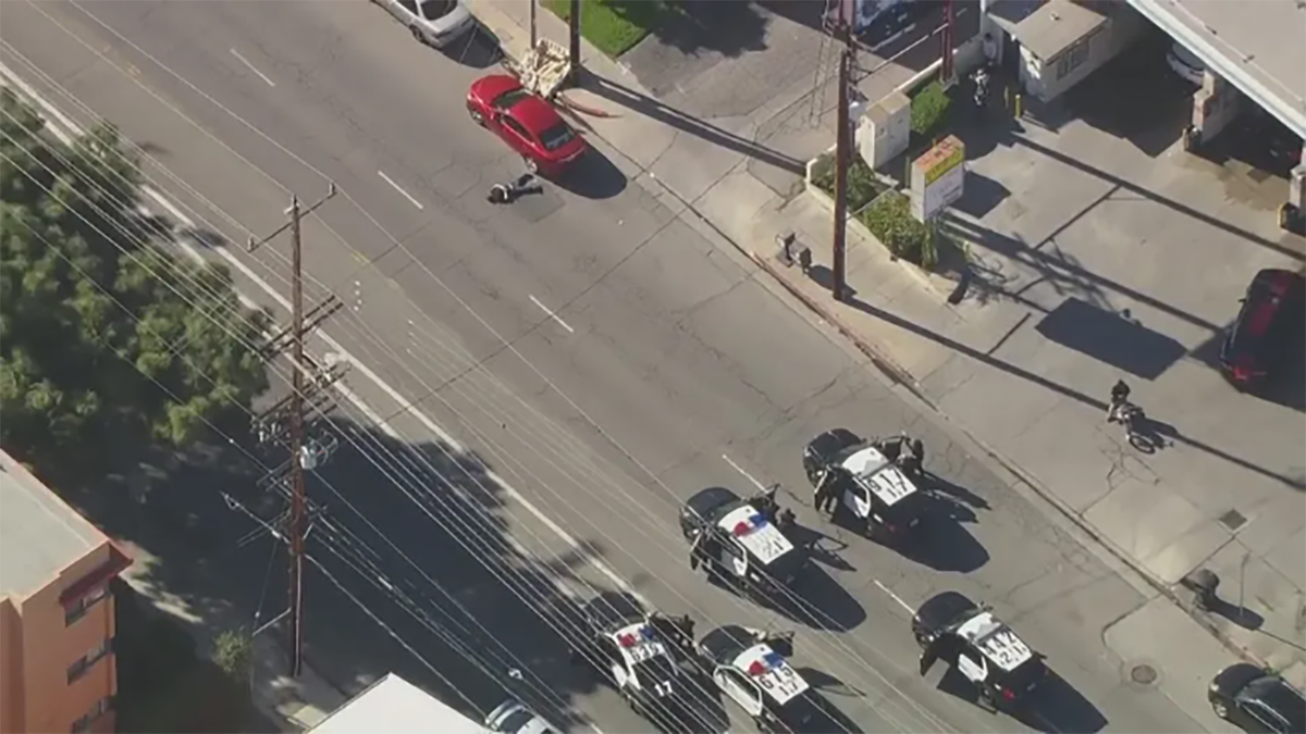 Aerial shot showing LAPD cars close in on suspect 