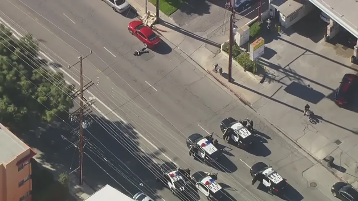 Aerial shot showing LAPD cars close in on suspect