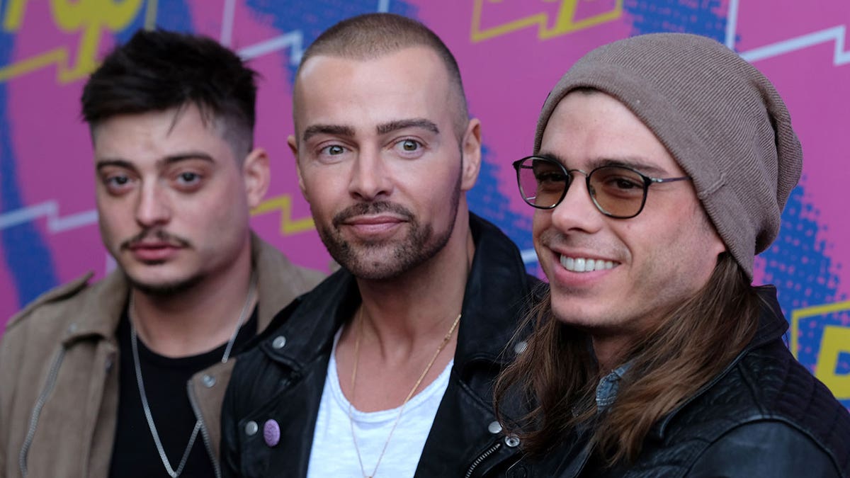 Lawrence brothers stand next to each other at Hollywood party