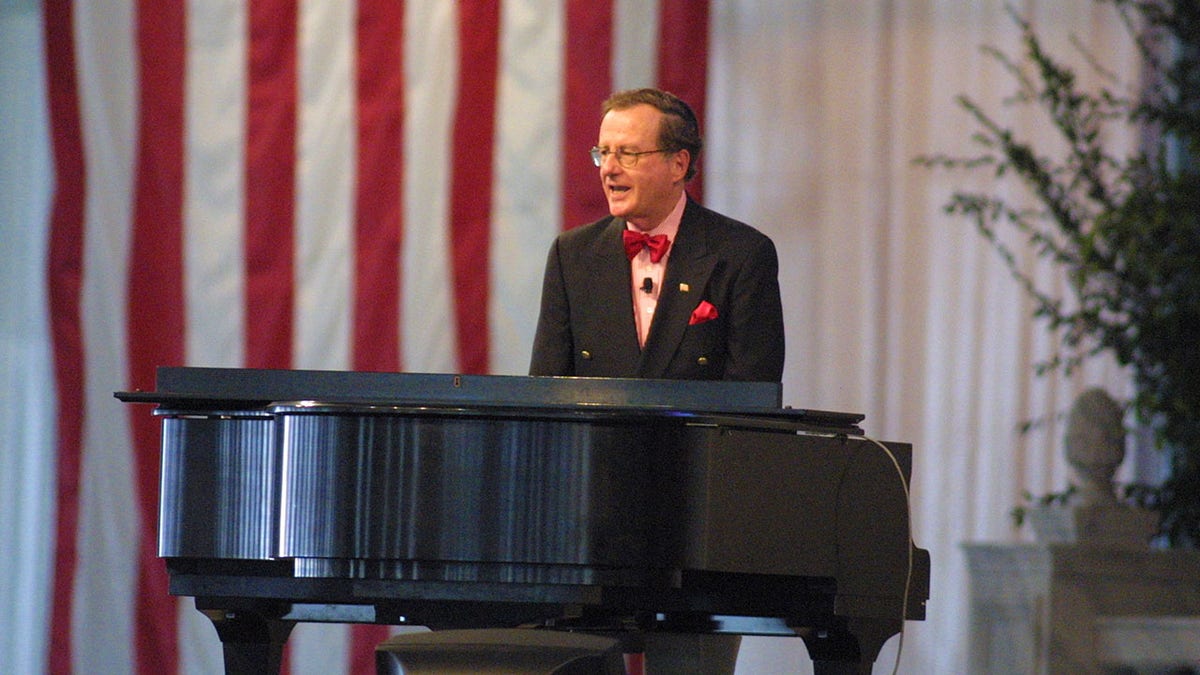 Mark Russell playing the piano