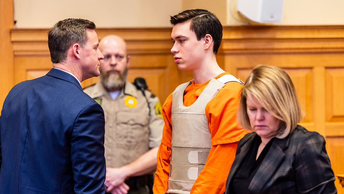 Willard Miller wears orange jumpsuit in courtroom