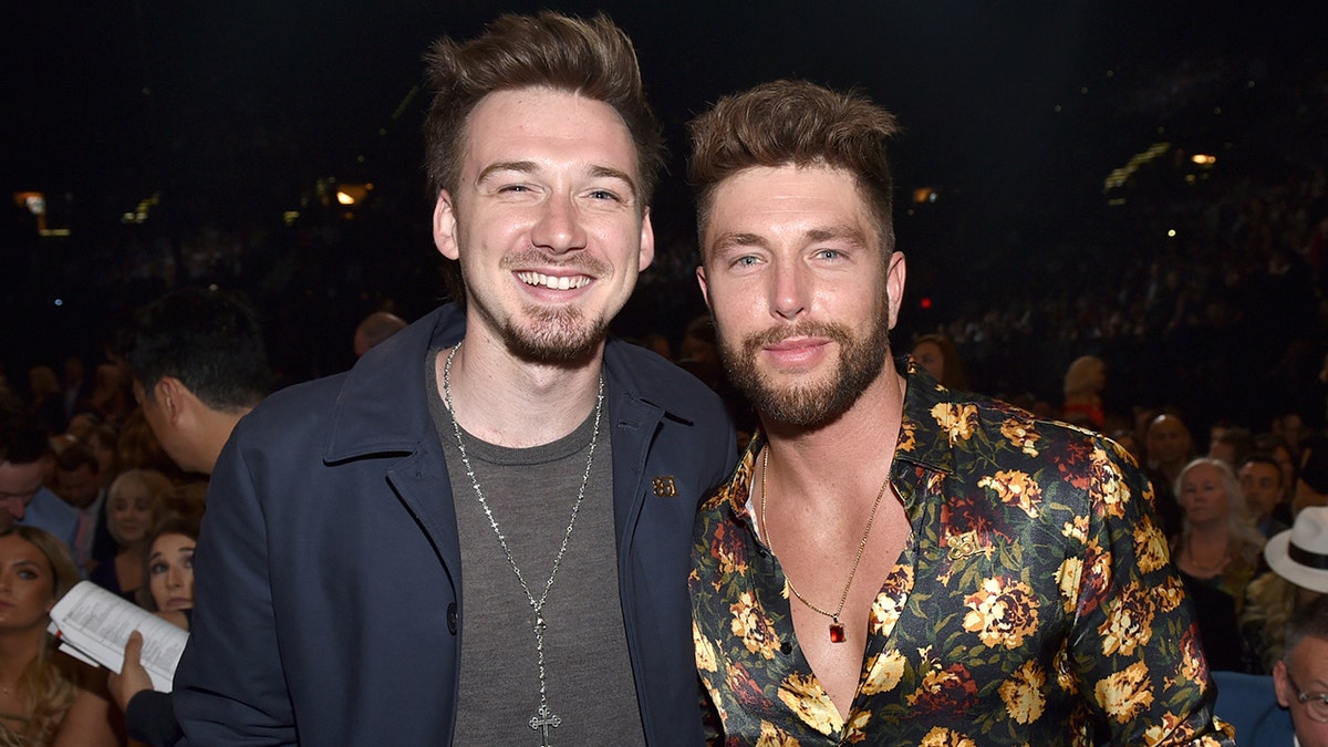 Chris Lane and Morgan Wallen smile at Academy Of Country Music Awards in 2018