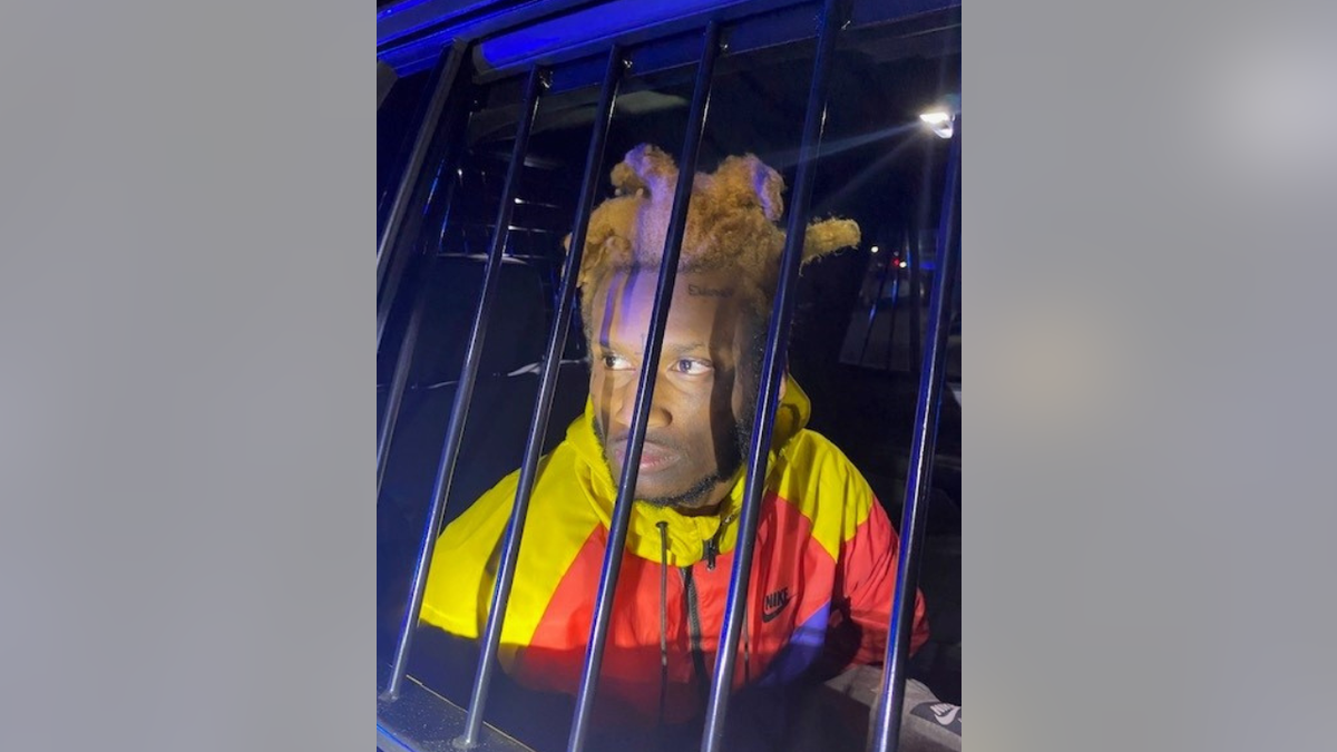 Kionta Parks in police car
