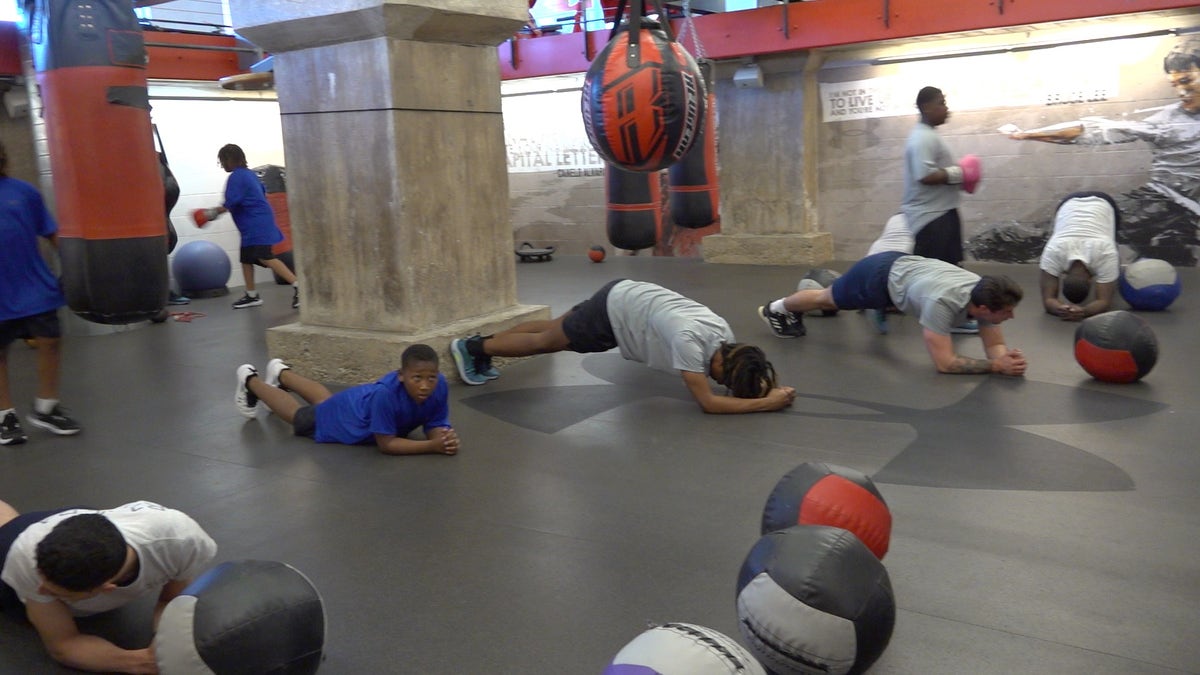 Baltimore boys and police do a fitness challenge together