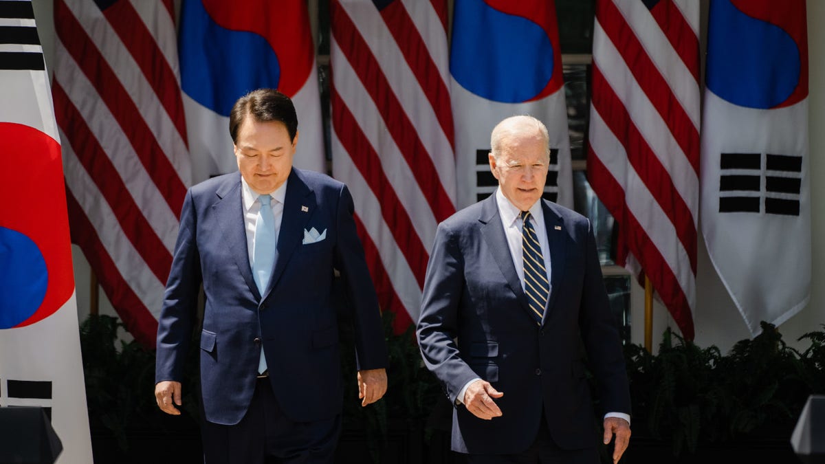 South Korean President Yoon Suk Yeol and President Joe Biden arrive for a joint press conference