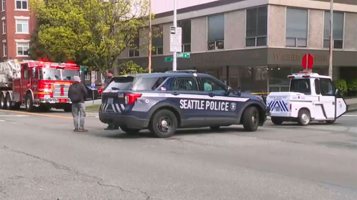 Seattle Police Department vehicles are parked outside of scene of reported explosion