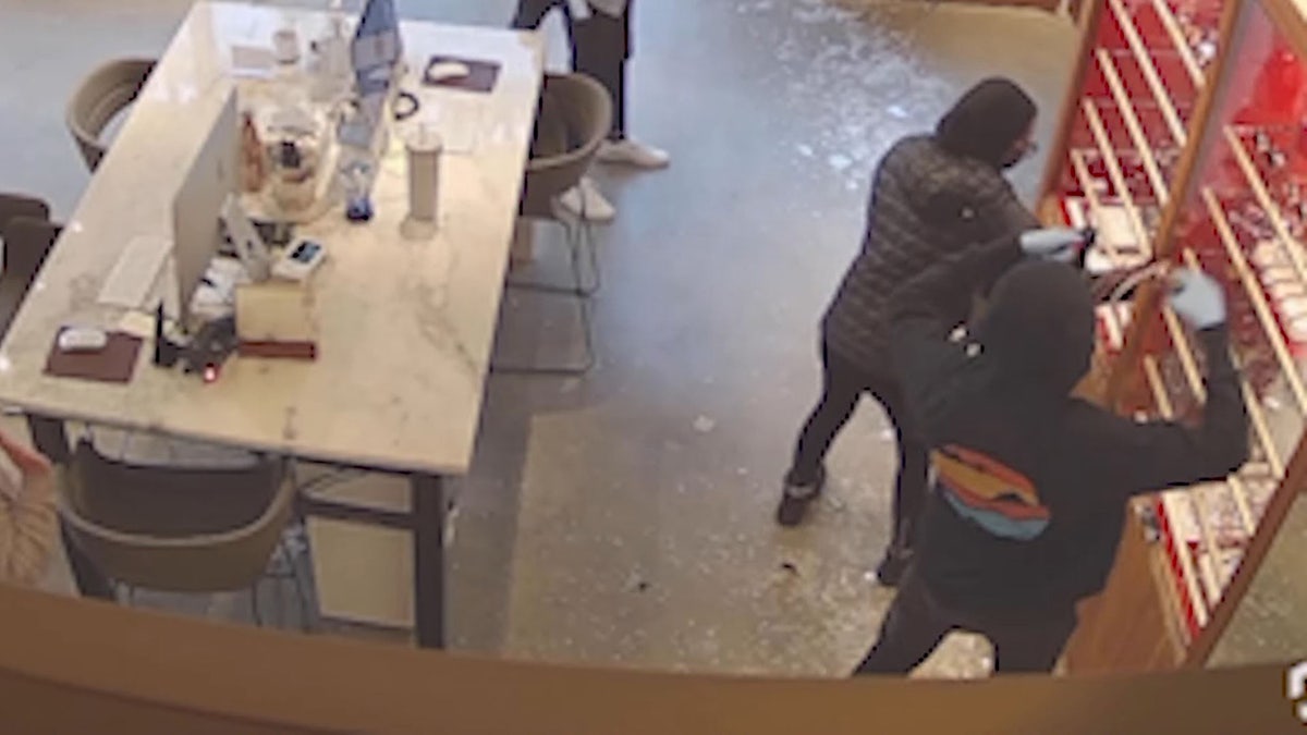 footage showing suspects grabbing eyewear from display