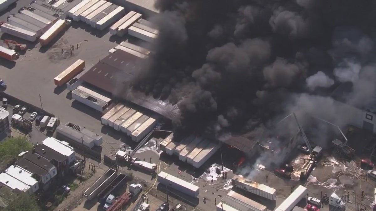 Black smoke over warehouse