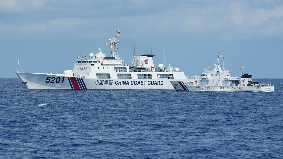 Chinese and Philippine coast guard boats facing off