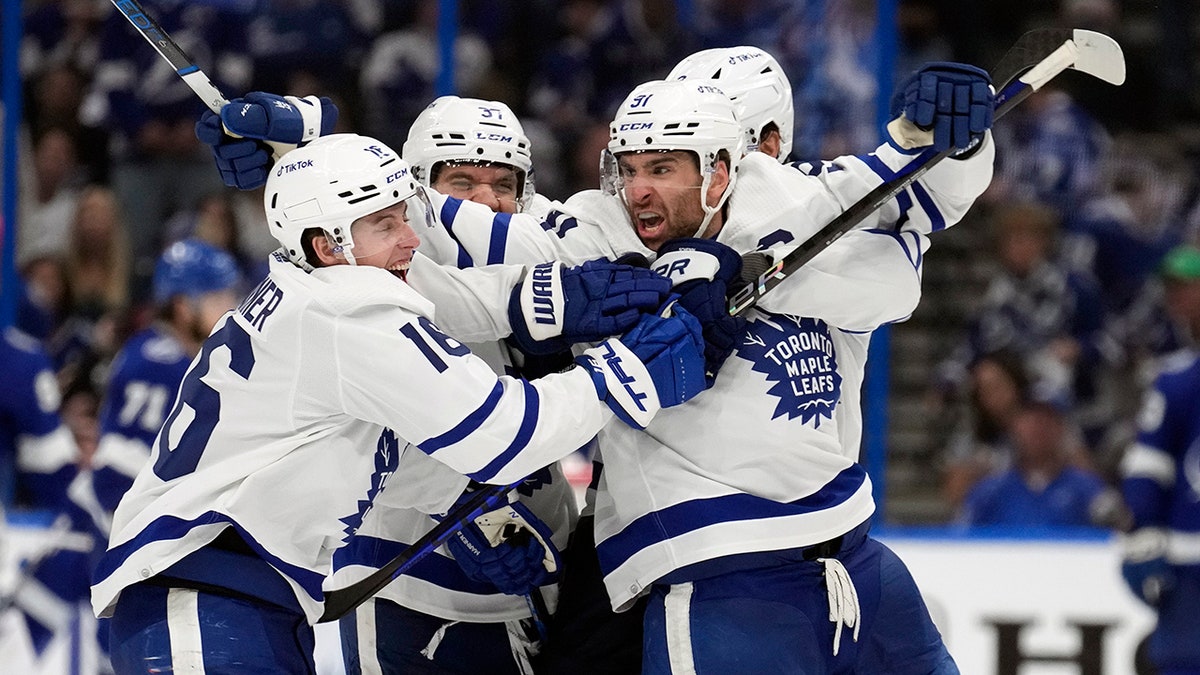 Toronto Maple Leafs center John Tavares (91) celebrates with right wing Mitchell Marner (16)