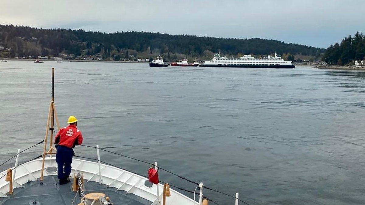 Coast Guard looking at ferry in shallow water