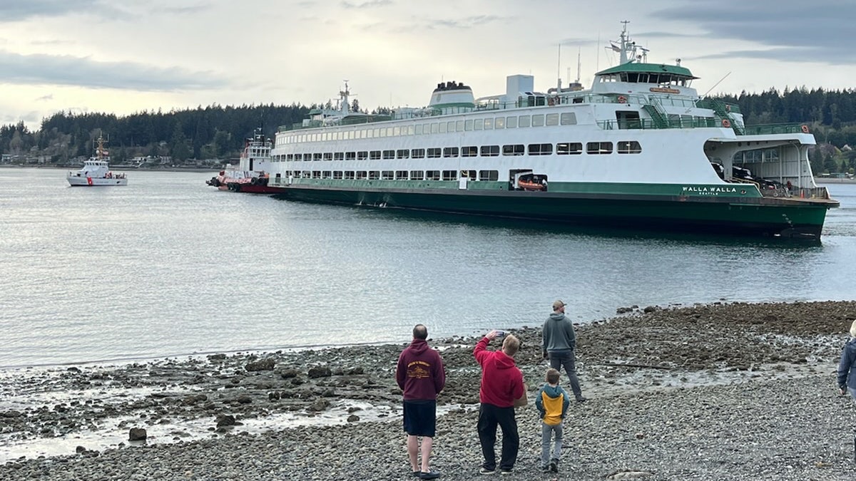 Walla Walla ferry stuck in shallow water near a beach