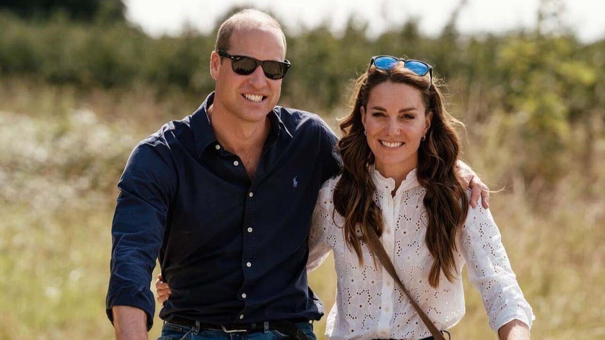 will and kate smiling while riding bicycles in the countryside