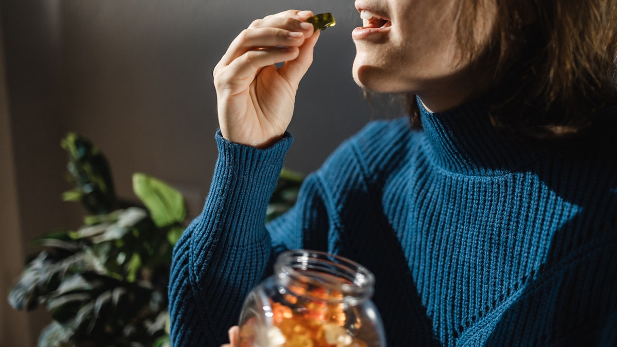 Woman taking gummies