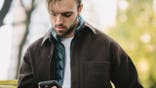Man looking down at his phone.