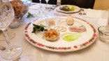 SEDER plate for Passover on the table with the word PESACH in Hebrew