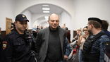 Russian opposition activist Vladimir Kara-Murza is escorted for a hearing at the Basmanny court in Moscow on October 10, 2022. - Vladimir Kara-Murza was jailed in April for denouncing the Kremlin's Ukraine offensive and has been charged last week with high treason - the charges which could keep him behind bars for two decades. (Photo by NATALIA KOLESNIKOVA / AFP) (Photo by NATALIA KOLESNIKOVA/AFP via Getty Images)