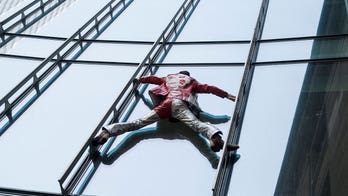 ‘French Spiderman’ free climbs Paris skyscraper to protest pension law
