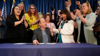 Colorado gov signs laws enshrining abortion, gender change treatments; critics see religious freedom threat