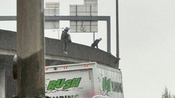 Cops walk homeless woman with bag on head off busy Seattle bridge: 'Just another day in the Emerald City'