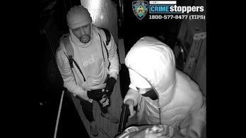 Video shows suspects threatening electronic store owner's family in armed robbery