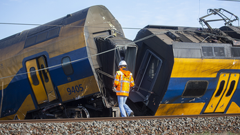 Passenger train derails after hitting construction crane in Netherlands, killing 1 and injuring dozens