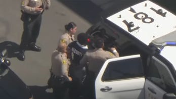 Los Angeles authorities pursue, capture female suspect in 'Security' shirt who stole armed police cruiser