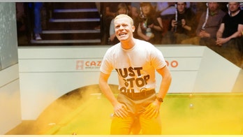 'Just Stop Oil' protester cancels world snooker championship after pouring orange dye on table