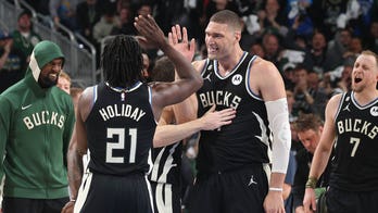 Bucks, without Giannis Antetokounmpo, dominate Heat to tie series at one