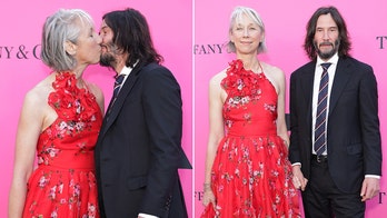 Keanu Reeves packs on PDA with girlfriend in rare red-carpet appearance together