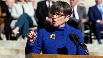 Kansas Gov. Kelly vetoes trans bathroom, youth sex change bans
