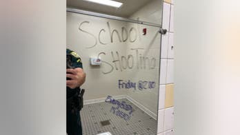 Florida teen girls arrested over ominous graffiti in school bathroom