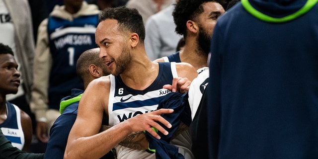 Kyle Anderson #5 of the Minnesota Timberwolves is held back by a teammate after an incident during a timeout in the second quarter of the game against the New Orleans Pelicans at Target Center on April 9, 2023 in Minneapolis, Minnesota.