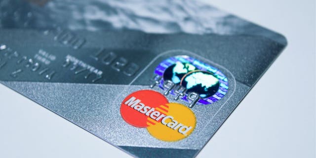 Photo of the MasterCard logo on the front of a credit card.