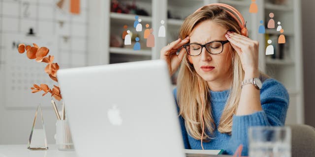 Woman sitting at her computer finding out that her laptop is affected by malware.