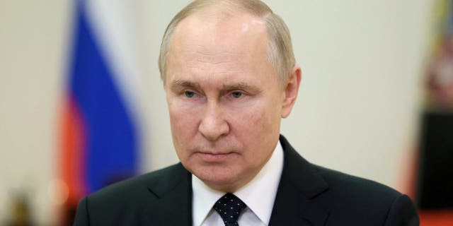Russian President Vladimir Putin congratulates security services officers and veterans on Security Agency Worker's Day, via video link at the Kremlin in Moscow in this picture released on Dec. 20, 2022.