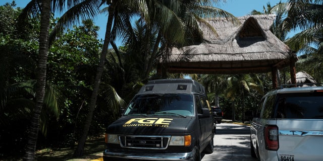 Police respond to the Fiesta Americana hotel in Cancun on Monday after four men were gunned down in an apparent drug-related incident.