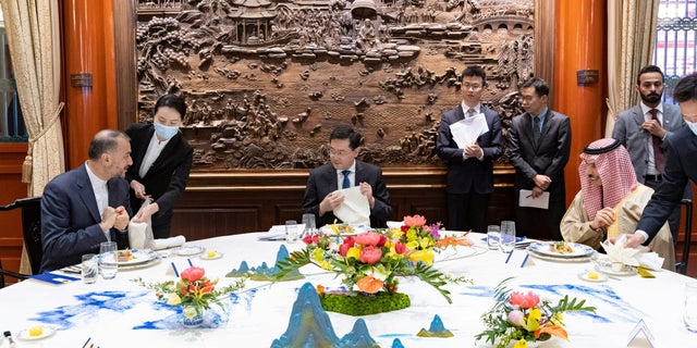 Iranian Foreign Minister Hossein Amir-Abdollahian, left, Saudi Arabia's Foreign Minister Prince Faisal bin Farhan Al Saud, right, and Chinese Foreign Minister Qin Gang during their meeting in Beijing, China, April 6, 2023.