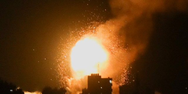 Smoke and flames rise during Israeli airstrikes in Khan Younis in the southern Gaza Strip, April 7, 2023.