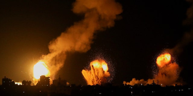 Smoke and flames rise during Israeli airstrikes in Khan Younis in the southern Gaza Strip, April 7, 2023.