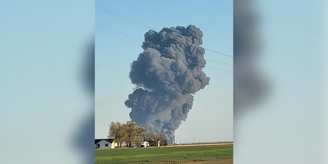 Plumes of smoke rise a day after a massive explosion at Southfork Dairy Farm in Dimmitt, Texas.