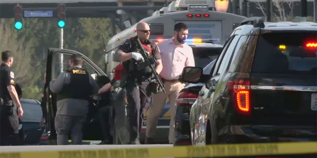 Police respond to an "active aggressor" situation in Louisville, Kentucky on Monday, April 10.