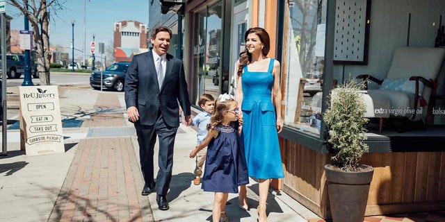 Gov. Ron DeSantis, first lady Casey DeSantis and their children walk through Troy, Ohio, April 13, 2023.