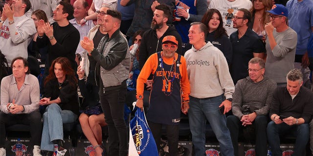 Fans of the New York Knicks cheer on their team