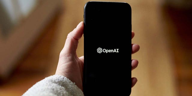 The OpenAI logo on a smartphone