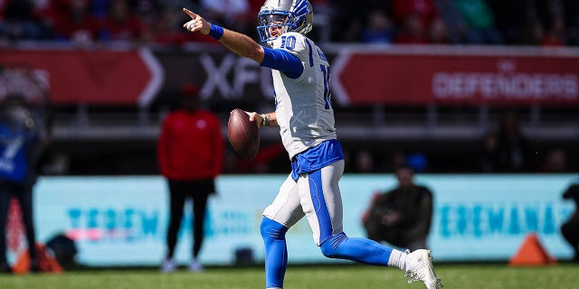 AJ McCarron looks down the field