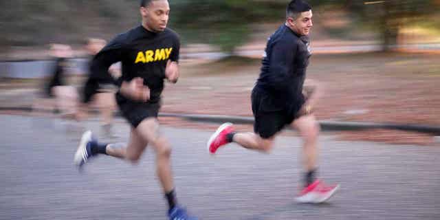 Army Staff Sgt. Daniel Murillo, right, runs up a hill as part of his physical training at Ft. Bragg on Jan. 18, 2023, in Fayetteville, North Carolina. Obesity in the military surged during the pandemic.