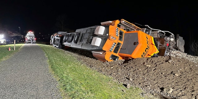 This photo provided by the Washington Department of Ecology shows a derailed BNSF train on the Swinomish tribal reservation near Anacortes, Wash., on Thursday, March 16, 2023. 