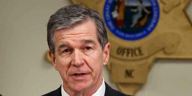 North Carolina Gov. Roy Cooper speaks at a news conference at the Moore County Sheriff's Office in Carthage, N.C., Dec. 5, 2022.